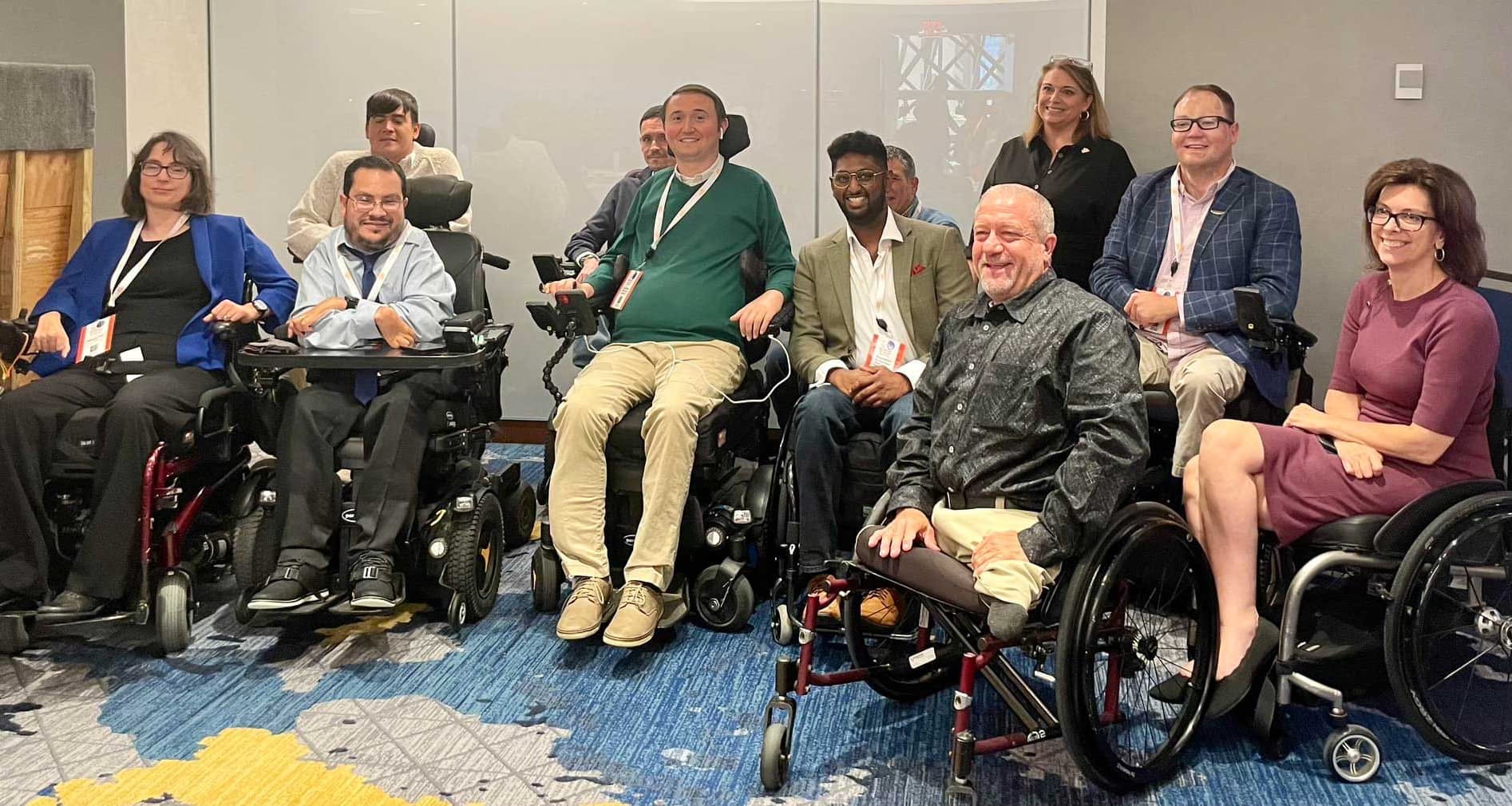 Group of wheelchair users pictured at conference.