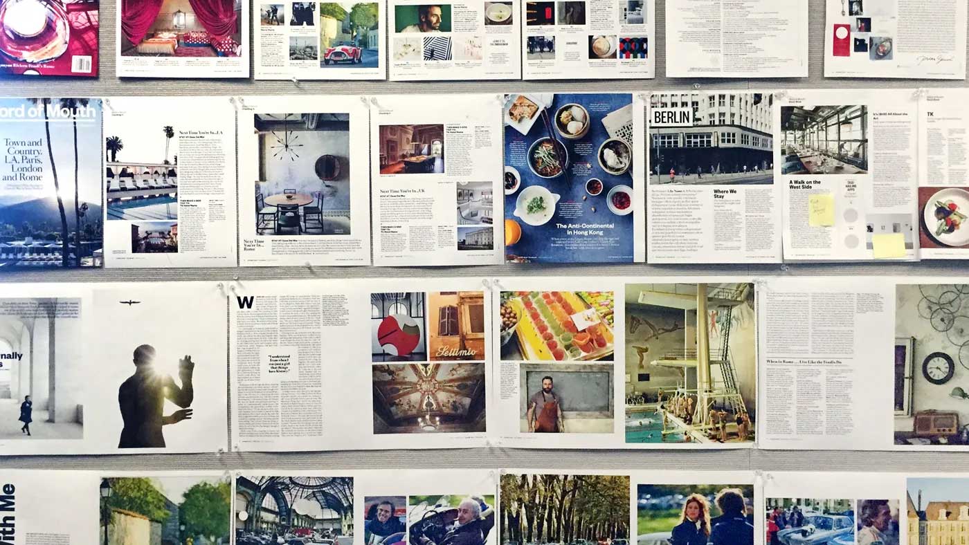 Multiple Condé Nast magazines laid out on a bulletin board.