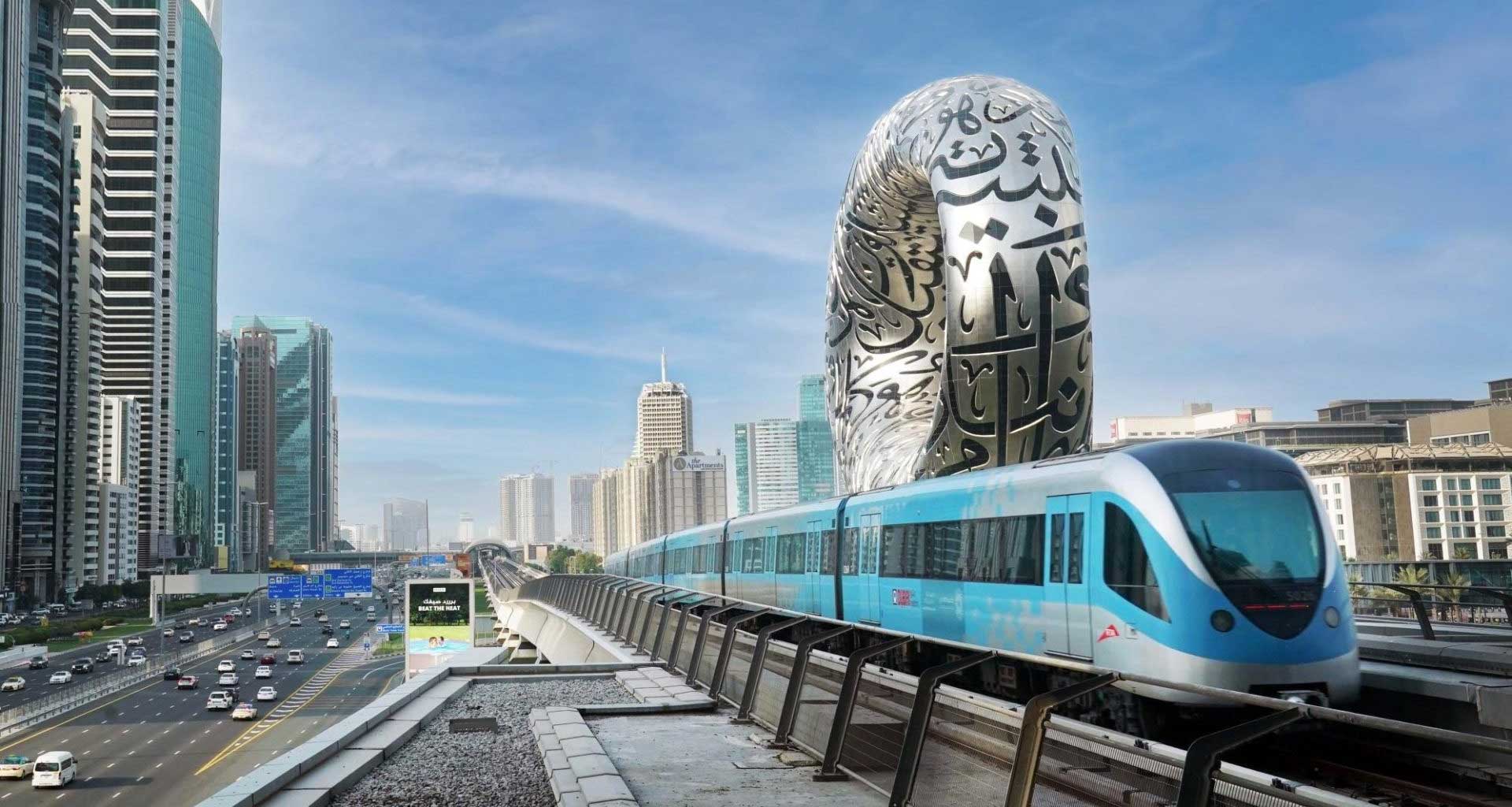 Dubai Metro train on track in center of city.