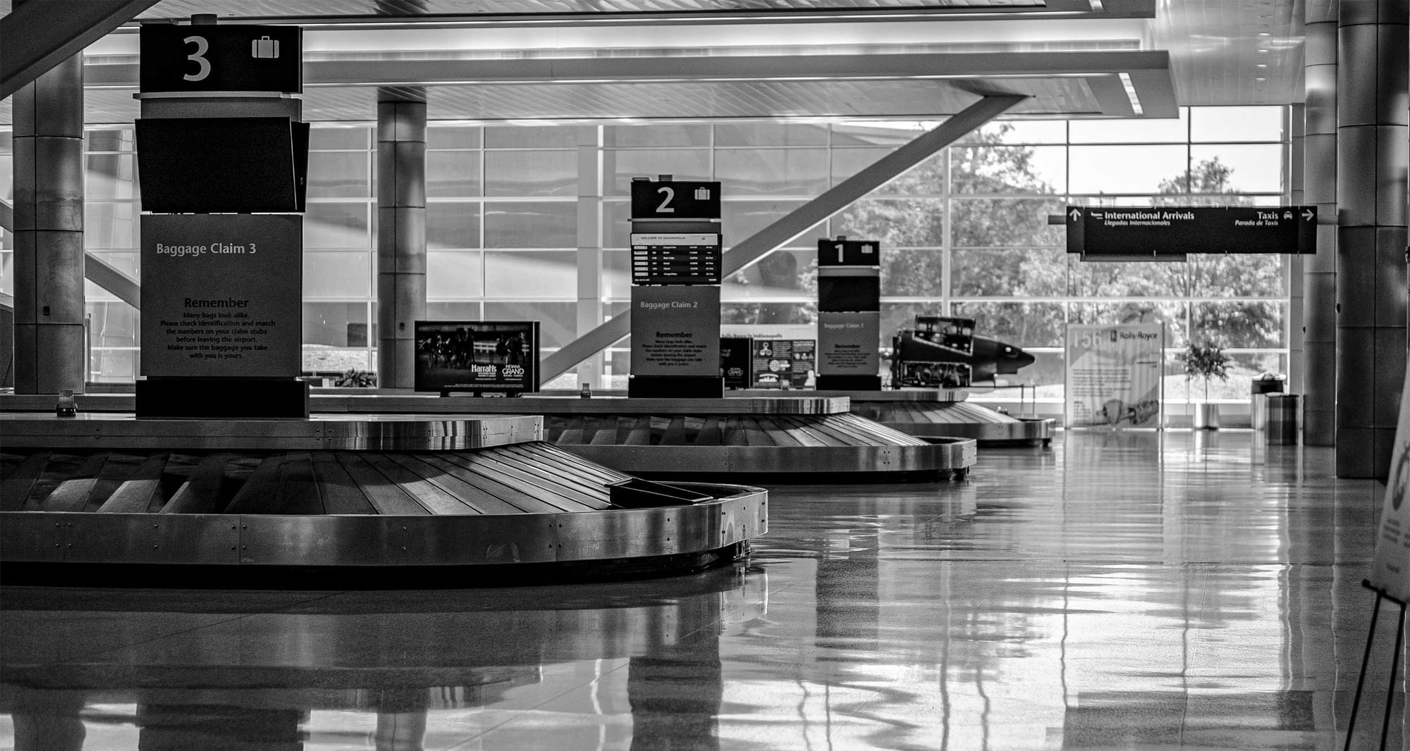 Baggage claim belts in an airport terminal.