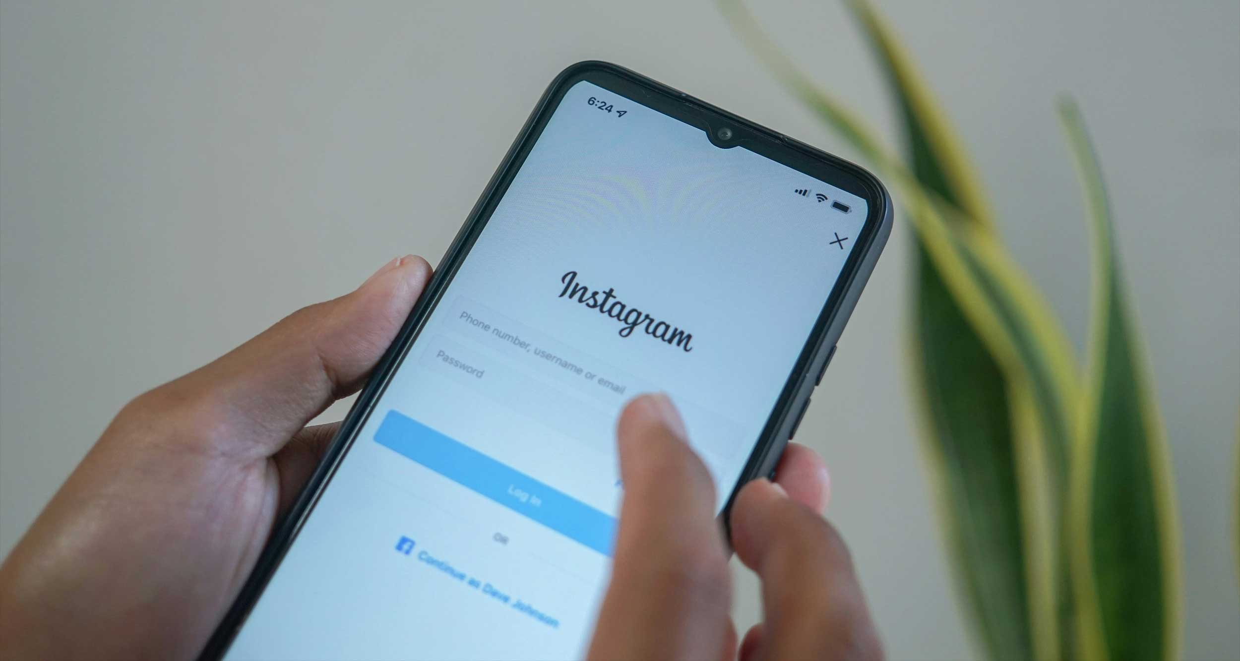 Person using Instagram app on smartphone device.