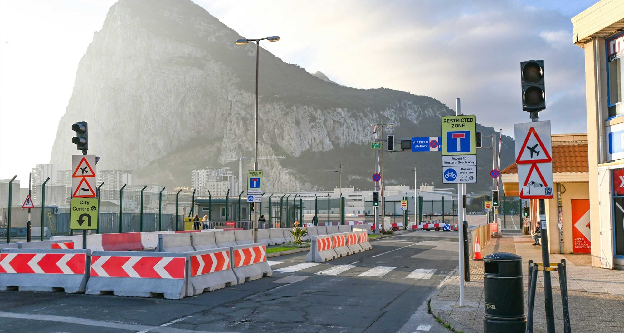 Street and sidewalk in front of the Rock of Gibraltar.