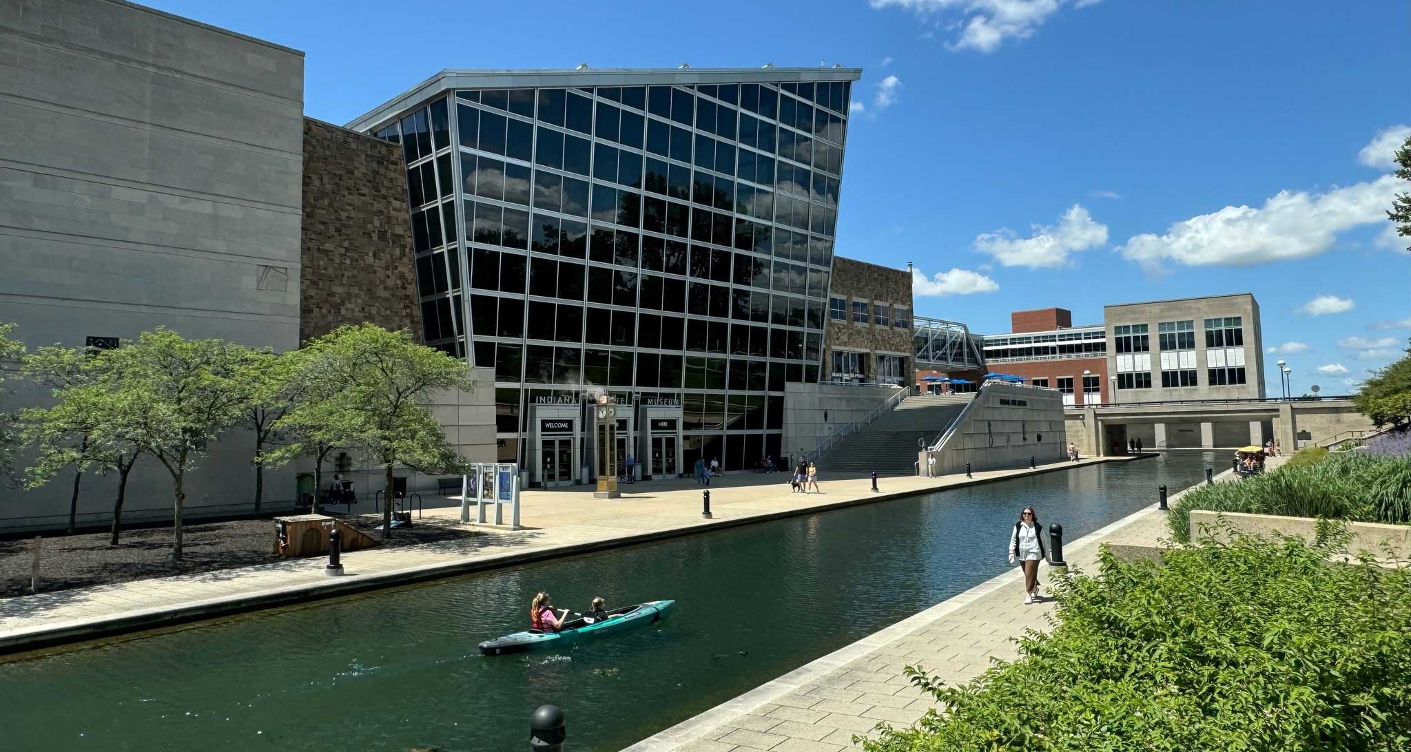 Museum next to canal with kayakers.