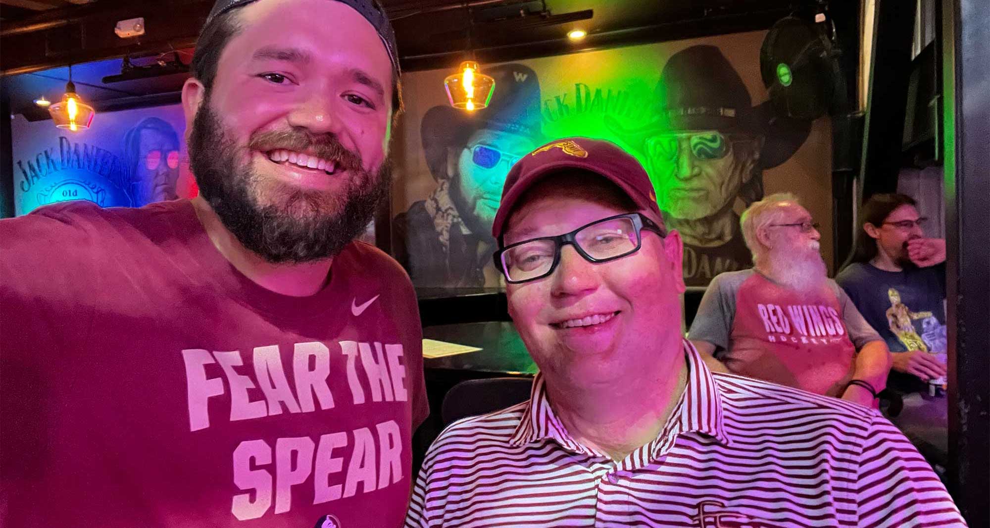 John pictured with friend at Nashville restaurant and bar.