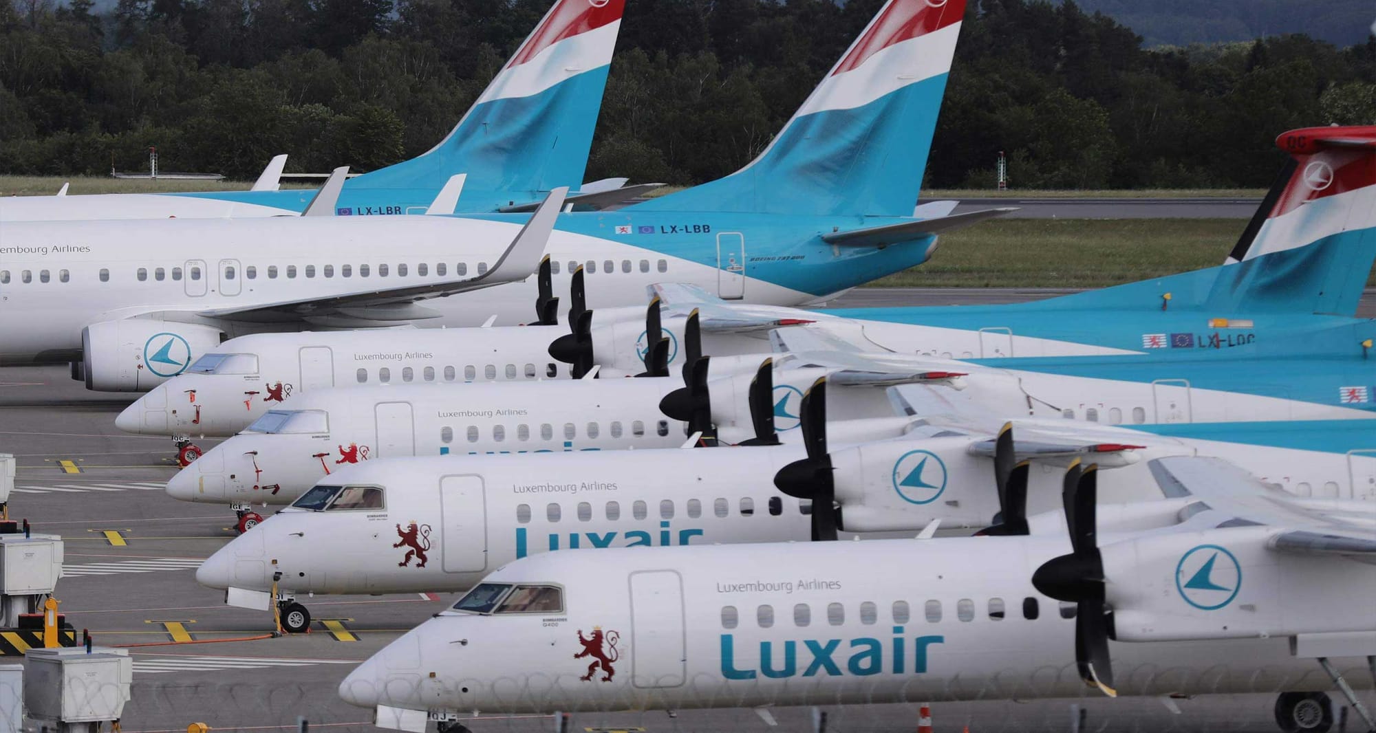 Line of Luxair airplanes at Luxembourg airport.