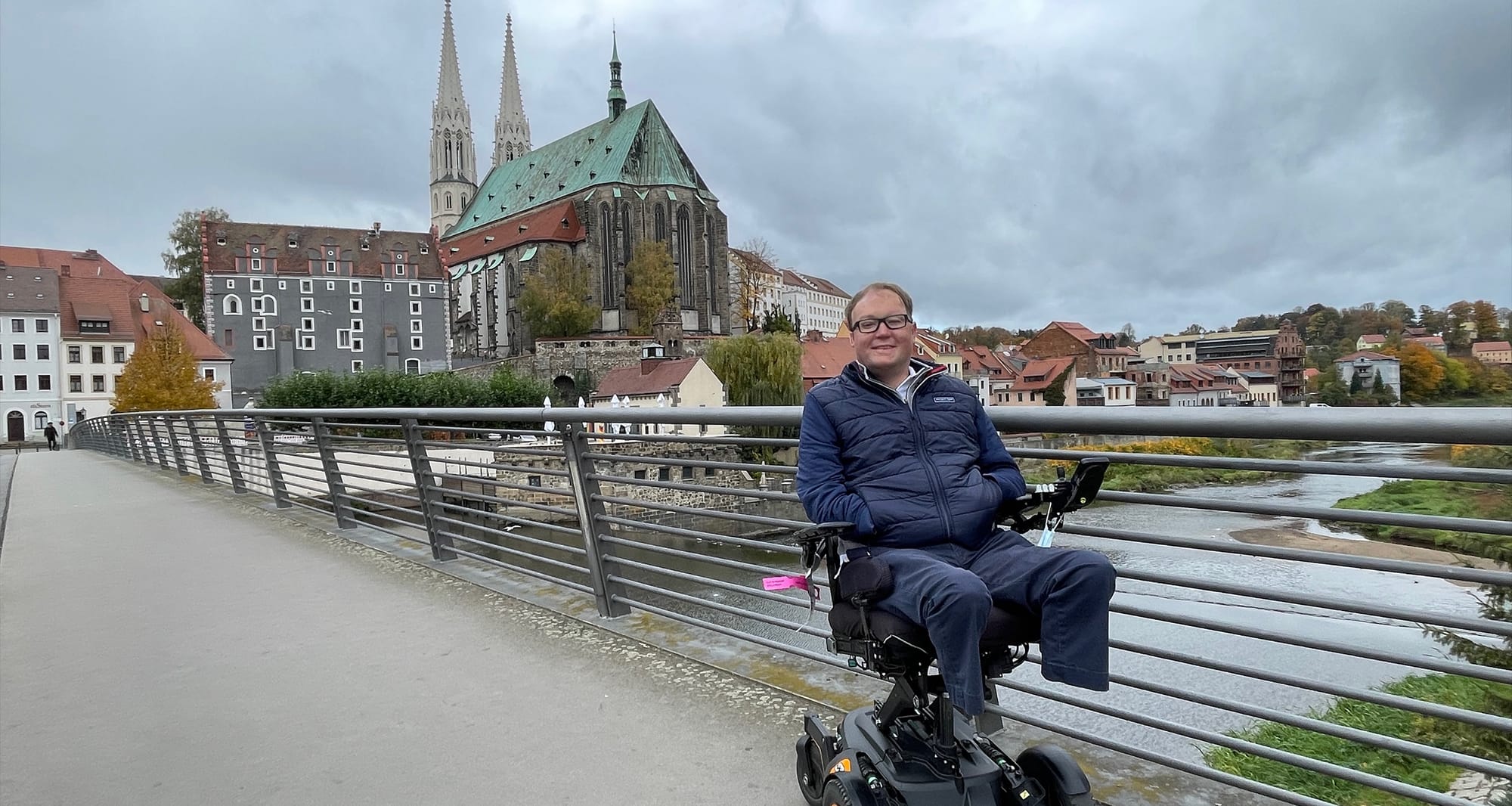 John on a bridge over a river that connects Germany and Poland.