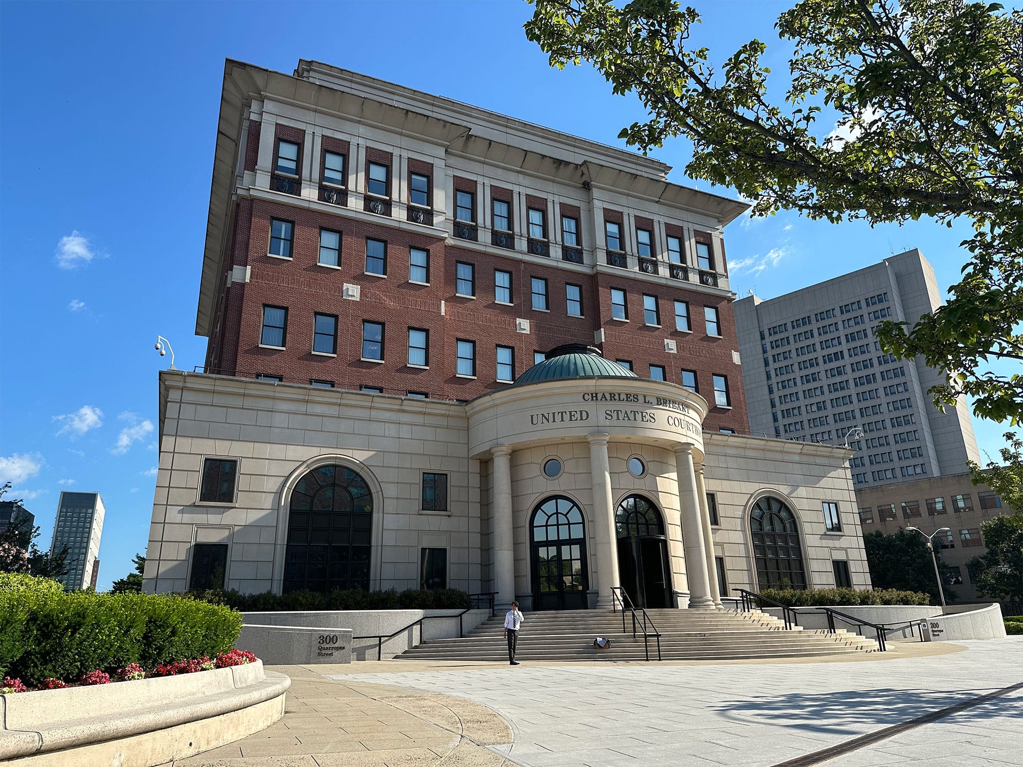 Exterior of federal courthouse on a sunny day in New York.