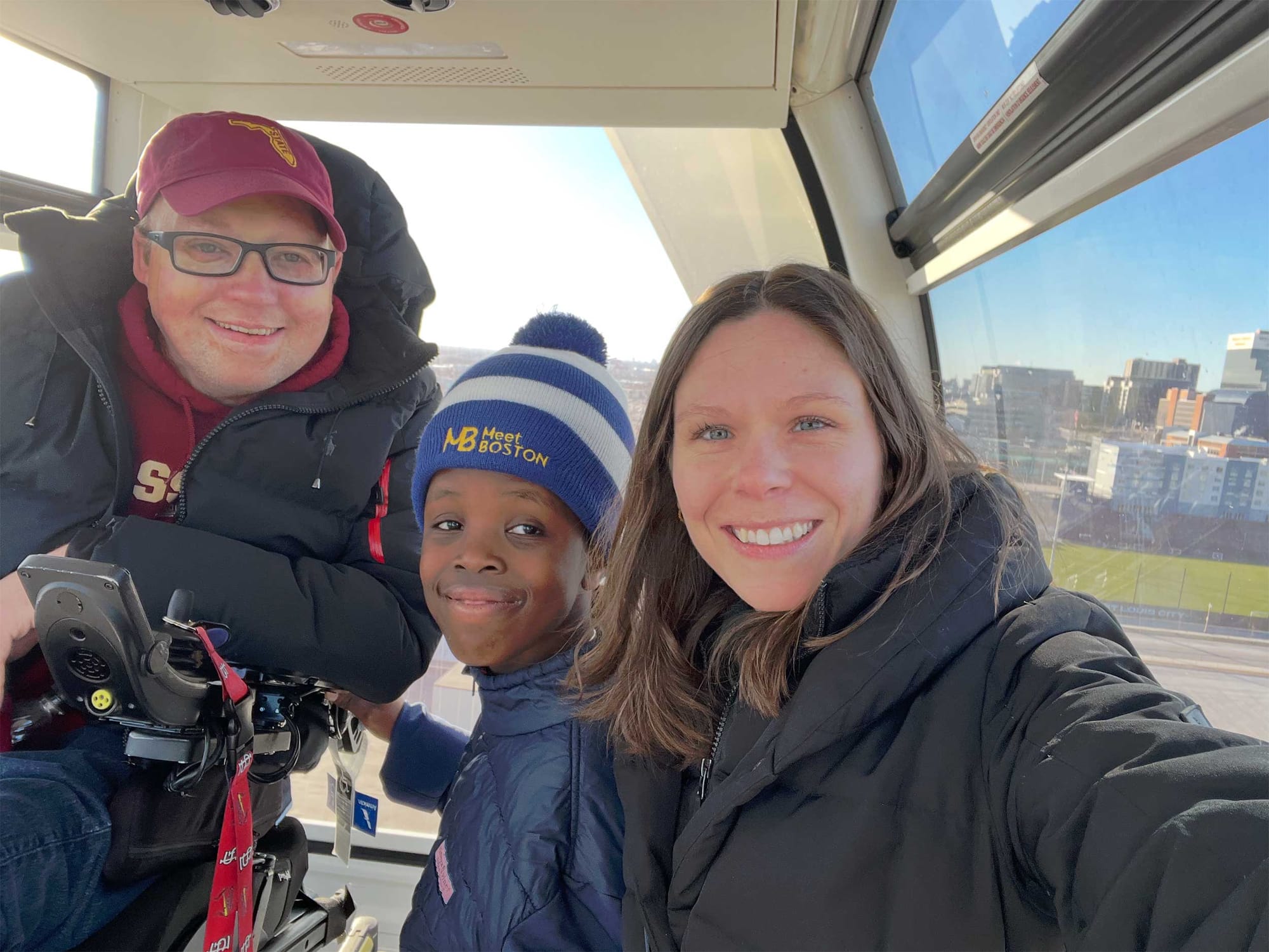 Selfie of John, Stevie and Robert inside of a ferris wheel.