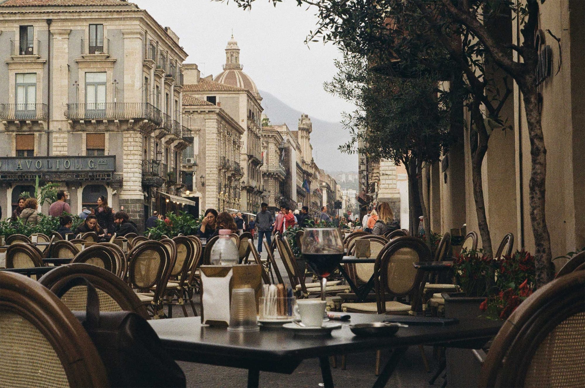 Restaurant tables on the street in Catania.