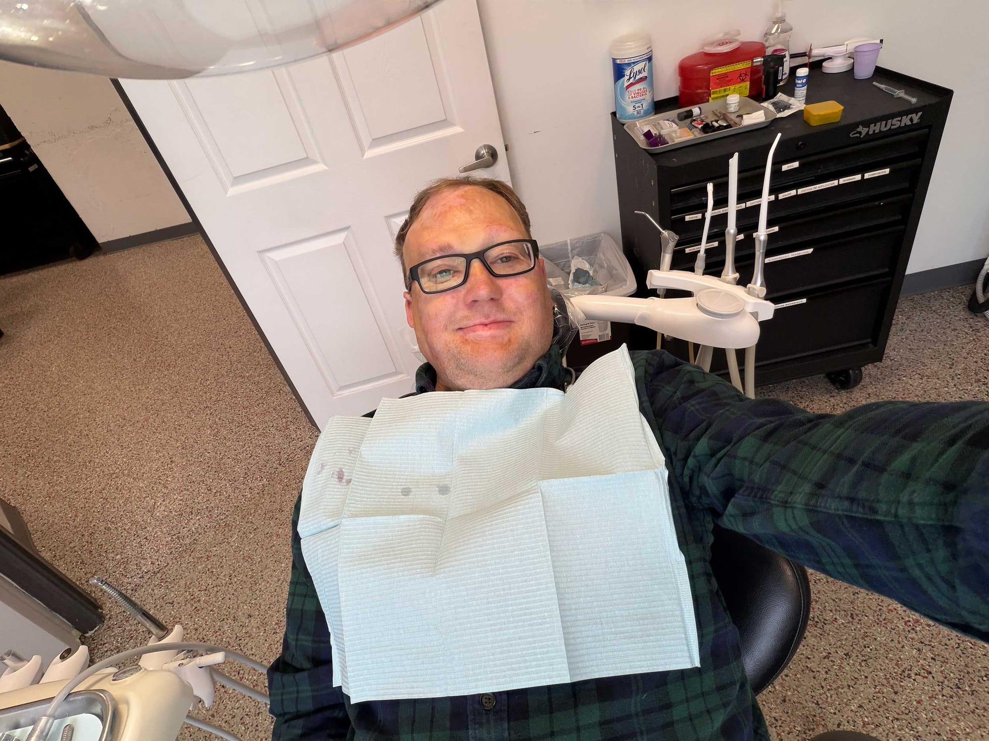 John seated in a dental chair.