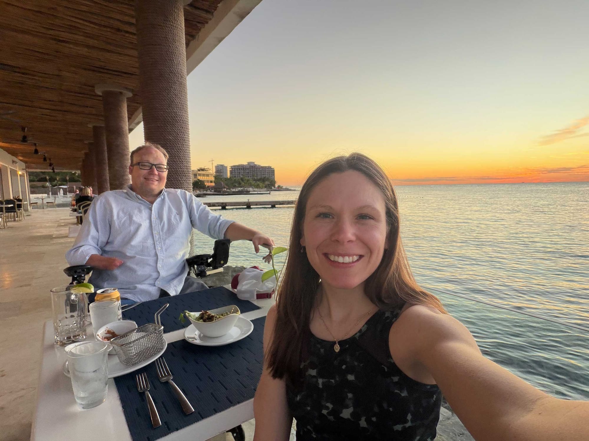 Selfie of John and Stevie at a sunset dinner.