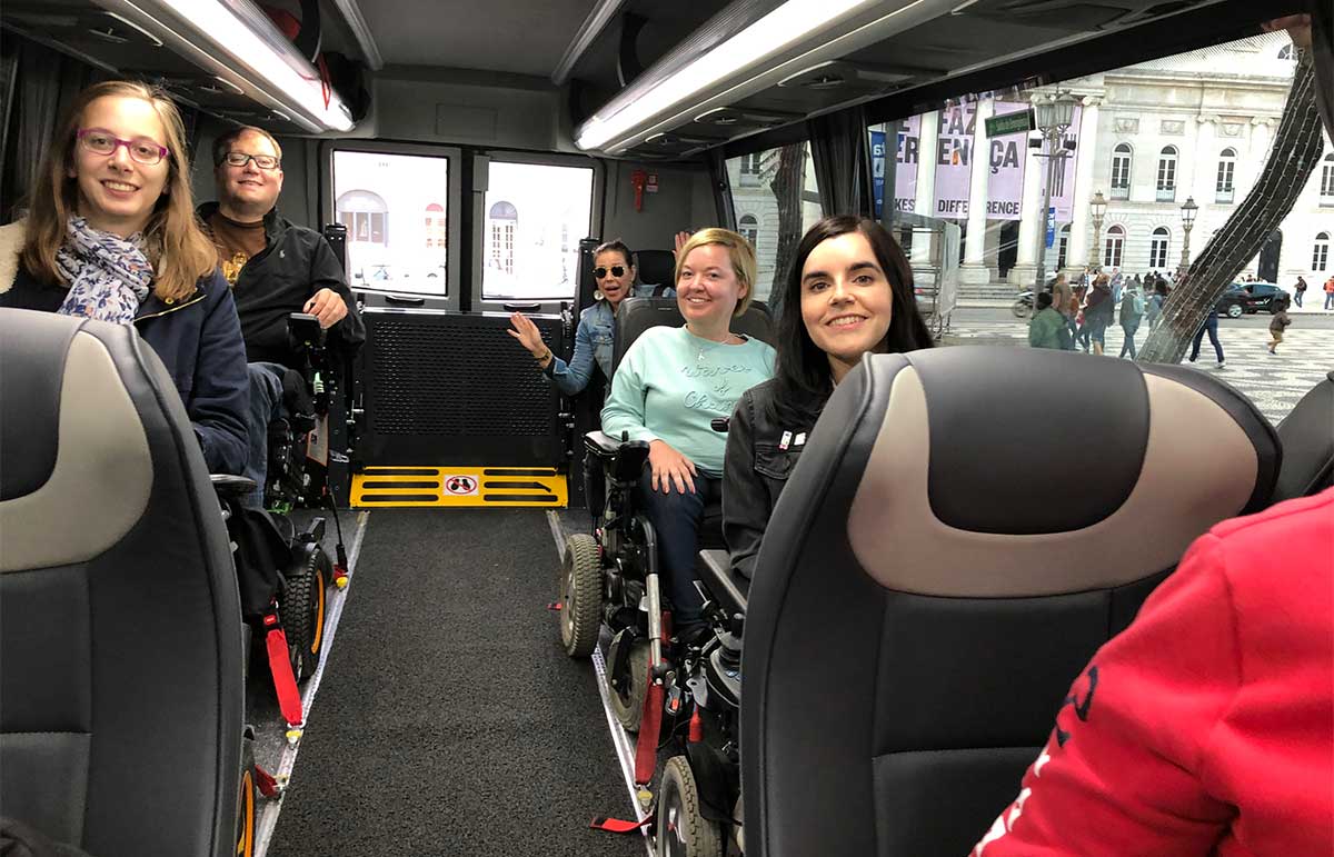 Wheelchair users inside accessible bus in Lisbon, Portugal.