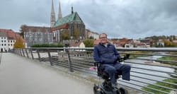 John on a bridge over a river that connects Germany and Poland.