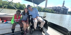 John, Stevie and Robert on a pontoon boat on the river.