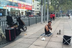 Chen Zhou Legless Street Performer