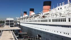 Lengthwise photograph of the exterior of the RMS Queen Mary.