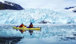 Wheelchair user kayaking in Alaska