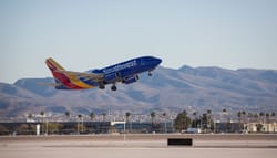 Southwest Airlines airplane taking off from airport.