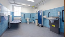 Accessible bathroom with adult changing table.