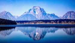 Mountain reflected in lake at a national park.