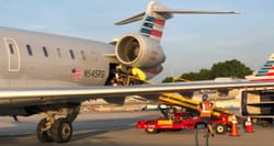 Power wheelchair loaded onto American Airlines CRJ-700 airplane.