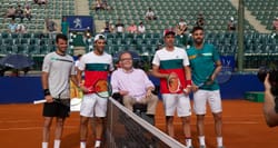 Wheelchair user at the net with 2020 Argentina Open Doubles finalists.