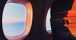 Airplane window and seatback.