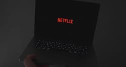 Netflix logo displayed on laptop computer screen.