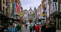 People walking on a city street in Dublin, Ireland.