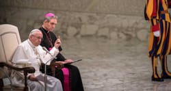 Pope Francis delivering a speech, with arm raised and finger pointed for emphasis.