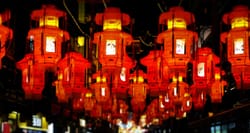 Lanterns hanging over a street in China.