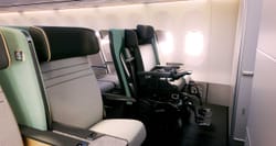 Power wheelchair secured in airplane cabin.