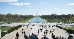 National Mall in Washington DC with reflecting pool and Washington Monument in the distance.