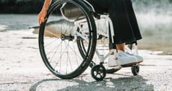 Close-up of young woman in manual wheelchair.