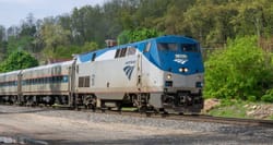 Amtrak train rolling down the tracks.