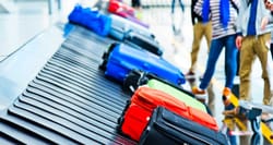 Luggage on an airport baggage carousel.