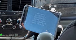 Photo of a message sent to a taxi driver displayed on a tablet device.