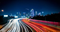 Dallas, Texas city skyline lit up at night.