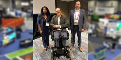 John with his co-panelists at a conference.