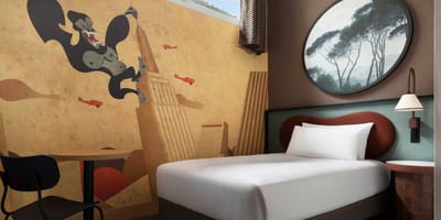 Single bed in wheelchair accessible hotel room.