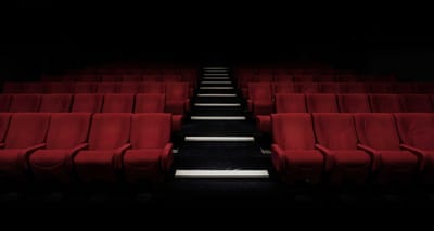 Seats in a darkened movie theater.