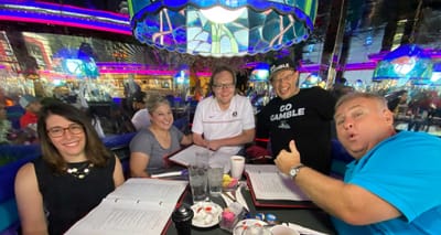 Group of friends seated at a restaurant table.