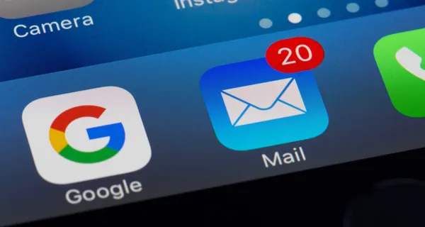 Close up photo of iPhone home screen with mail app highlighted.