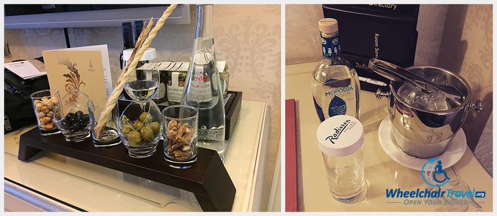 Photo Description: Hotel welcome amenity consisting of olives, nuts and breads, together with still water.