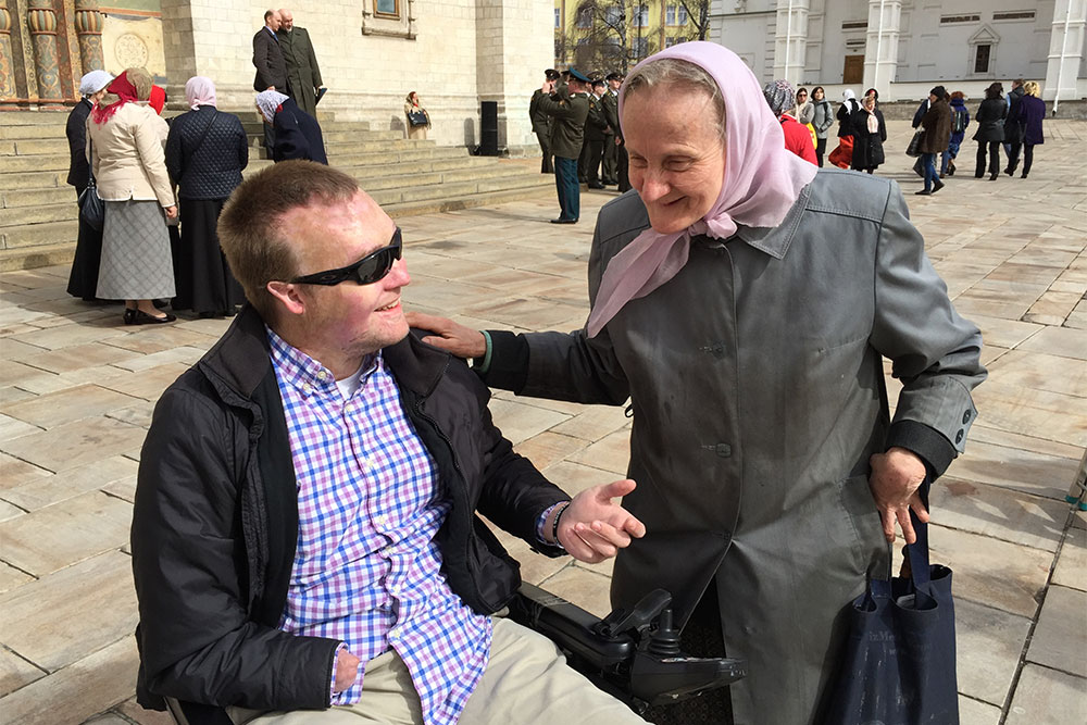 John Morris with an elderly Russian woman inside The Kremlin in Moscow