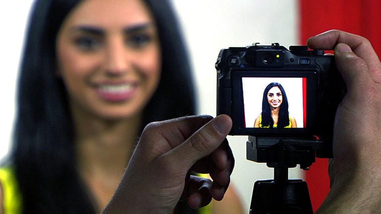 Woman Taking A Passport Photo