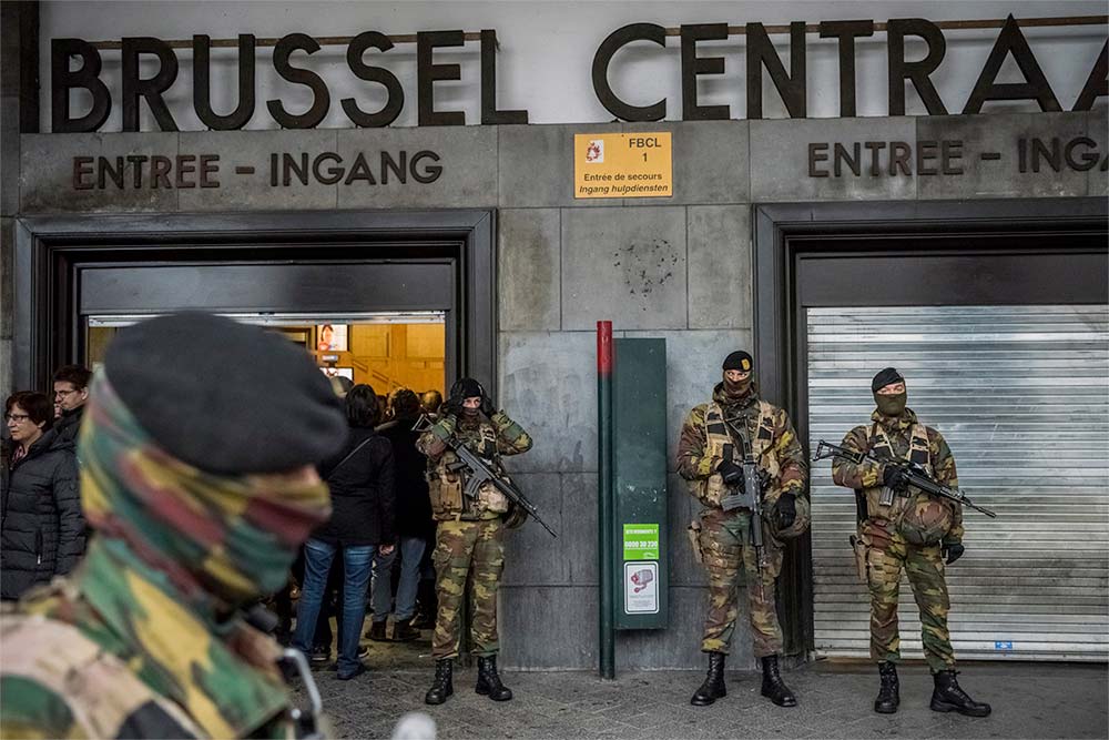 Photo Description: Belgian military units guarding the closed Centraal Train Station in Brussels.