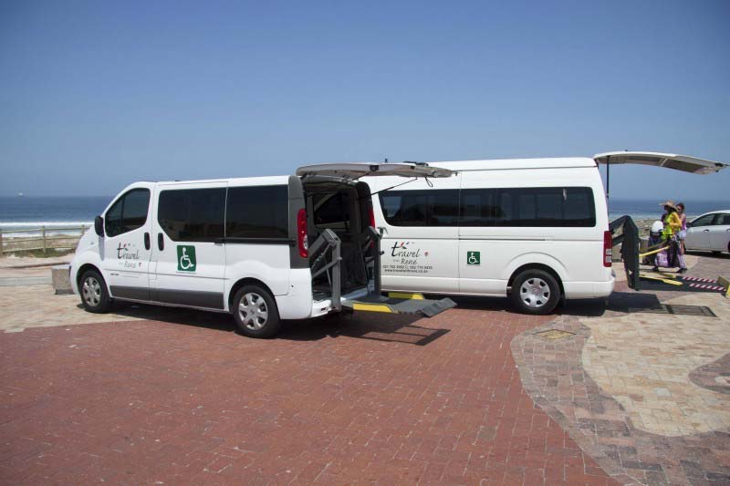 Photo Description: Two Travel with Rene wheelchair accessible vans with electronic lifts parked at a beach on Cape Town, South Africa.