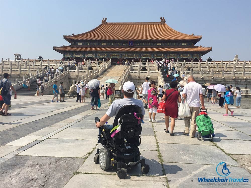 PHOTO DESCRIPTION: John Morris, in his wheelchair, in the Forbidden City.