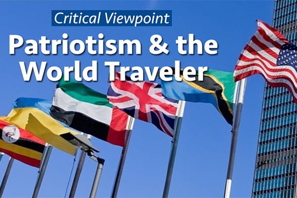 Photo Description: Multiple flags flying outside the United Nations headquarters, with the following text overlayed: 'Critical Viewpoint - Patriotism & the World Traveler'.